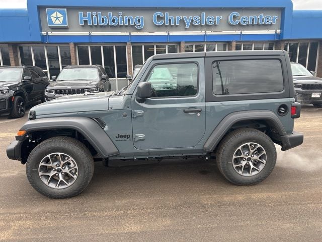 2026 Jeep Wrangler Sport S in Anvil Clear Coat — front three-quarter view