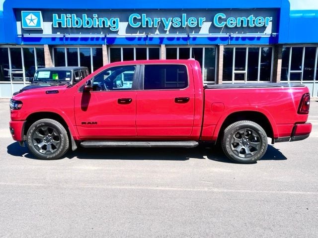 2025 RAM 1500 Big Horn/Lone Star in Flame Red Clearcoat — front three-quarter view